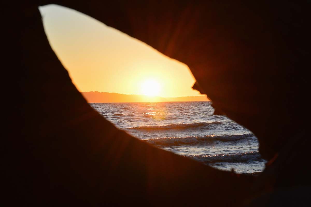 saltwater state park hole overseeing orange sunset des moines